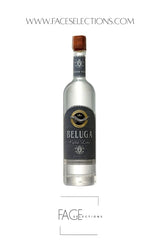A bottle of Beluga Fish Sauce by FACE Selections, featuring a clear glass bottle with a dark navy blue label and a brown cork stopper, set against a plain white background with website text overlays.